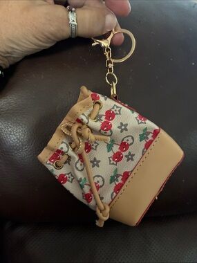 High fashion poop bag! Attaches to leash or?